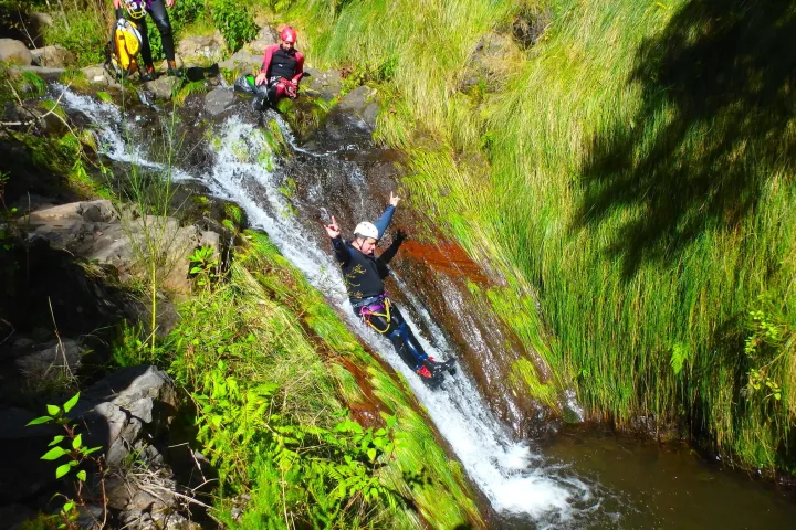a large waterfall over a body of water