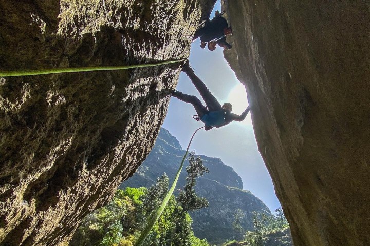 a man climbing a mountain