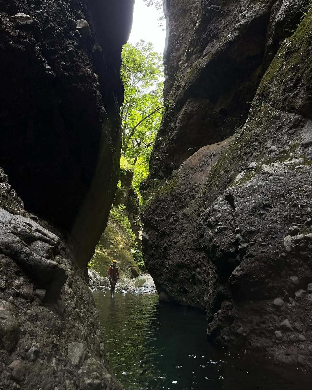 Canyoneer in a narrow, wild canyon in Madeira, explored by the EPIC Madeira team