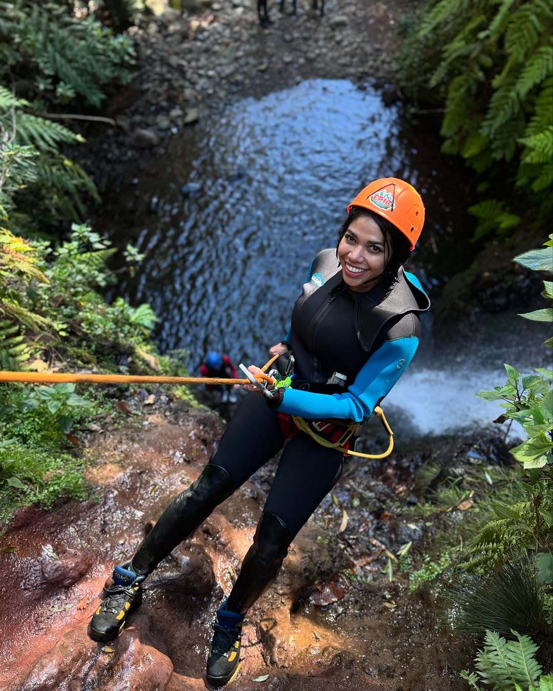 Smiling canyoneer on a rope during a beginner canyoning tour in Madeira with EPIC